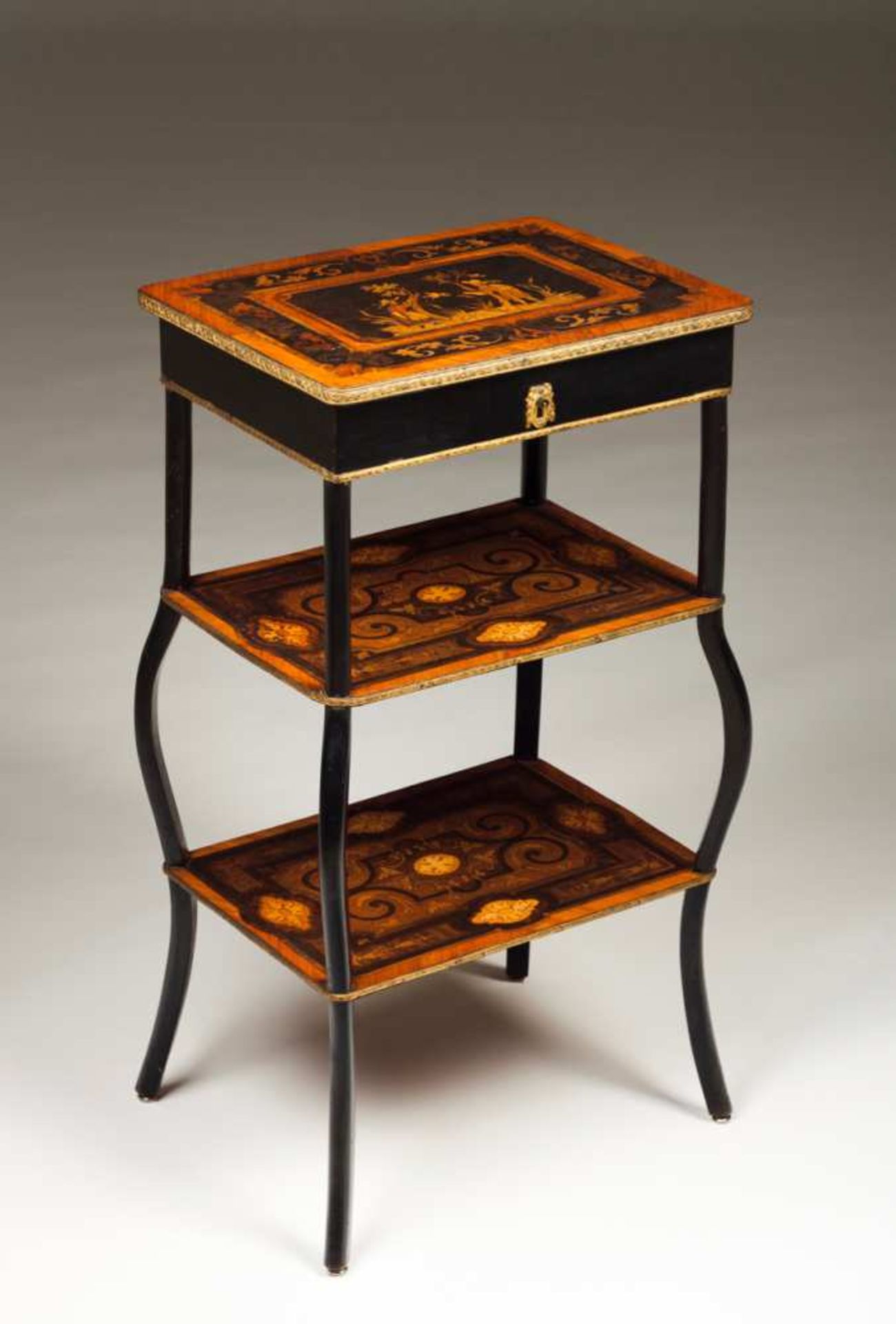 A Napoleon III Gueridon Walnut with marquetry decoration depicting scrolls, floral motifs and top