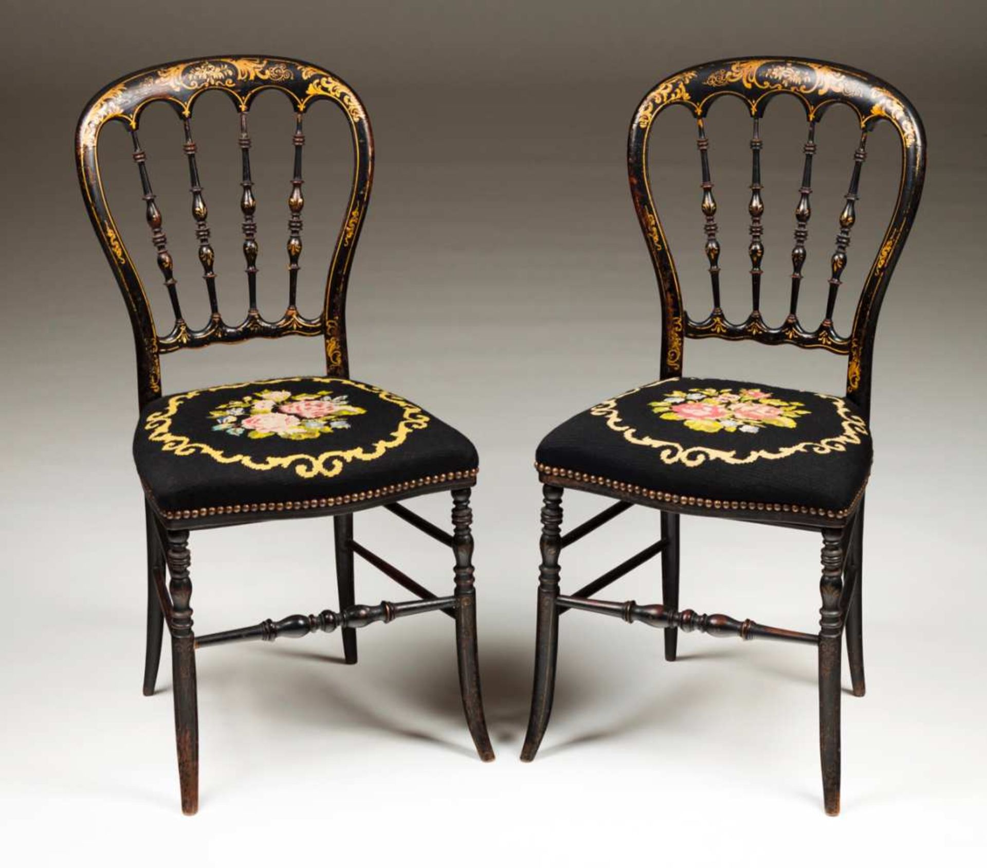 A pair of Napoleon III chairs Black lacquered wood with gilt decoration depicting floral motifs