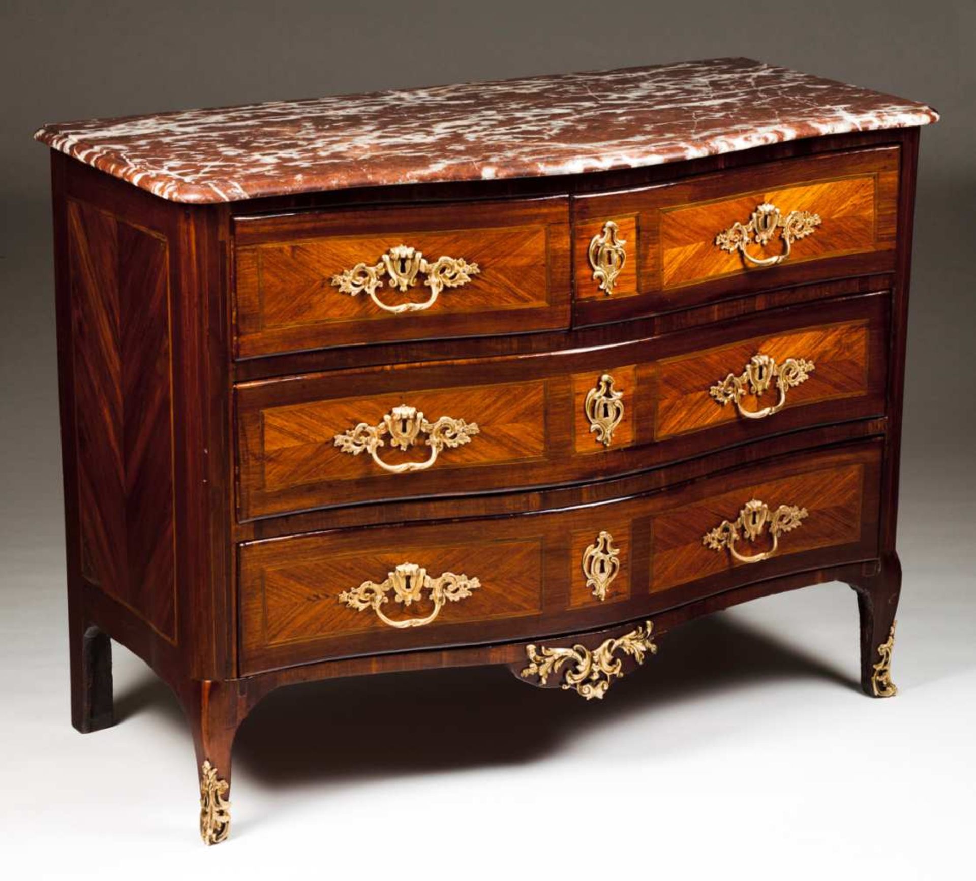 A Louis XV commode Rosewood, thornbush, satinwood and boxwood Two long and two short drawers
