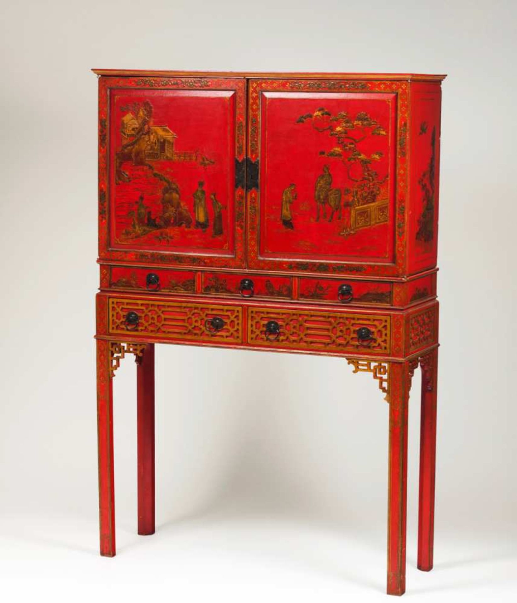 A cabinet on stand Red lacquered wood Decorated with gilt and black chinoiseries representing floral