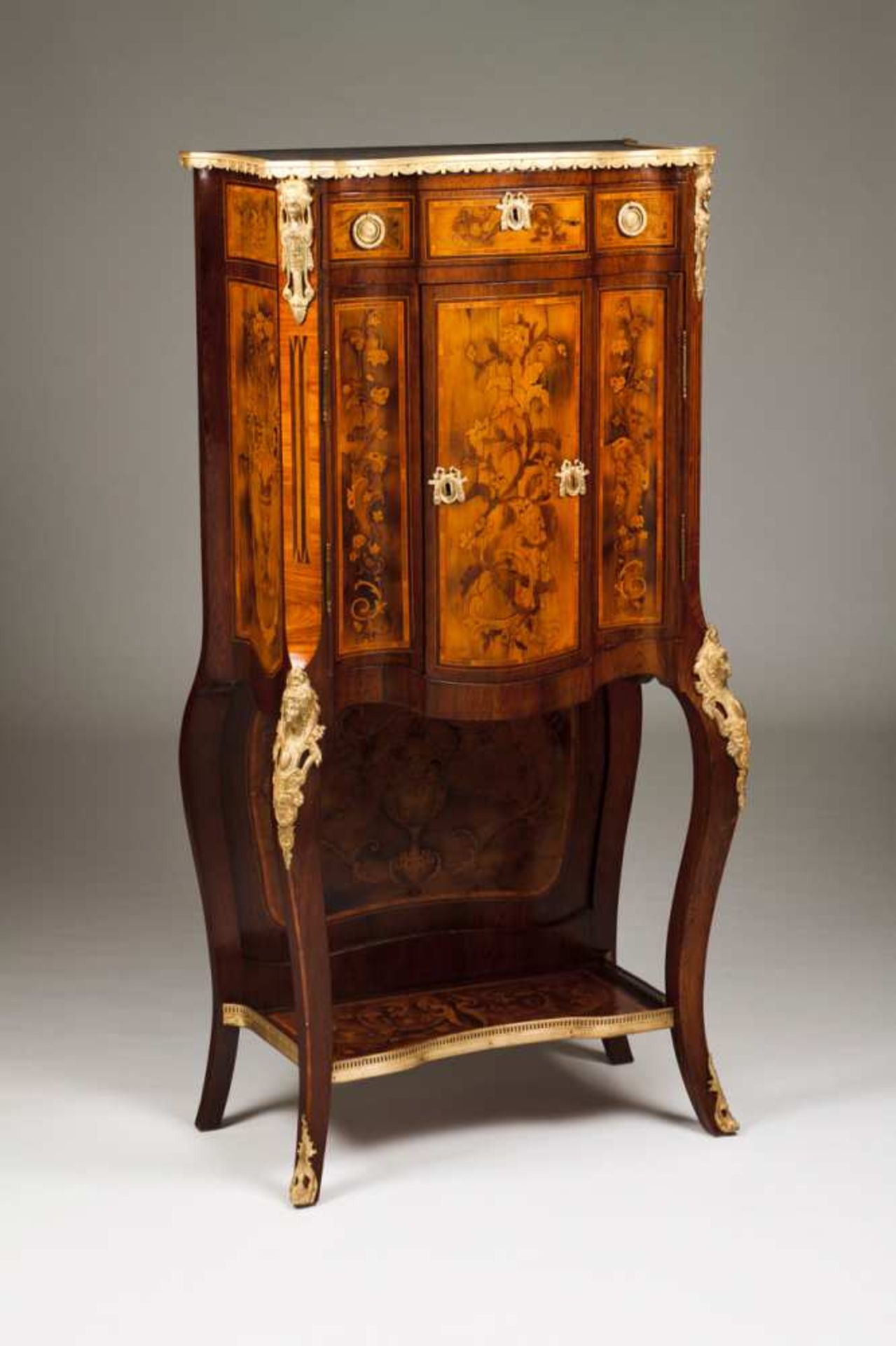 A Louis XVI style cabinet Rosewood with marquetry decoration depicting urns and floral motifs Gilt