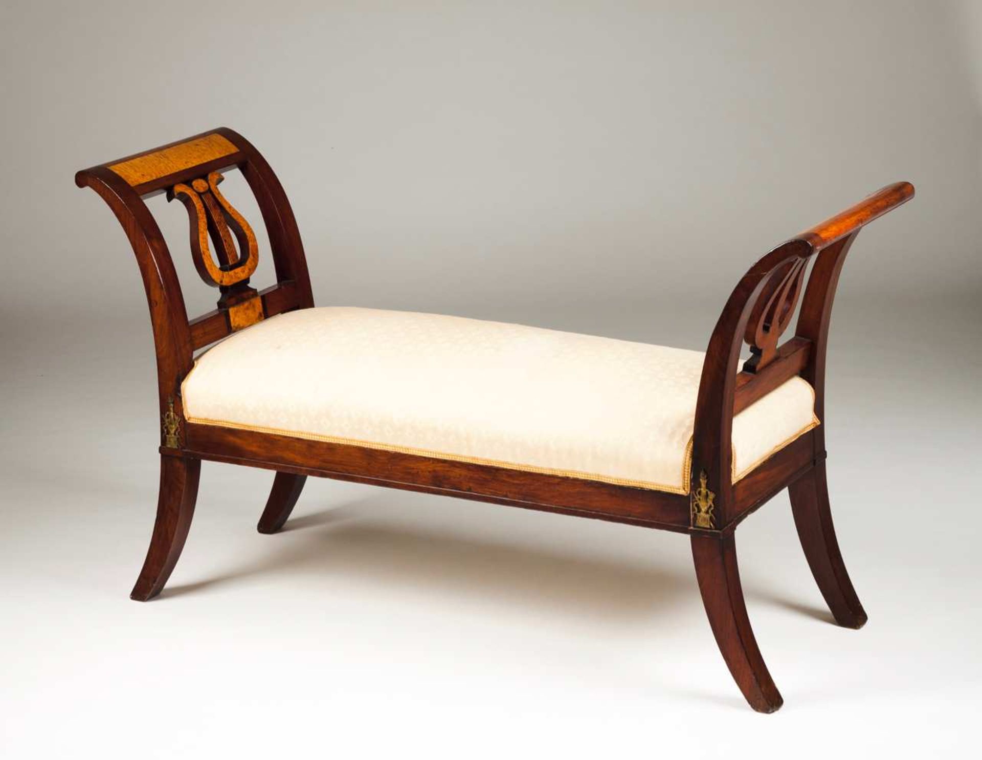 An Empire settee Mahogany Burr-olivewood veneered Pierced sides with lires French, 19th century