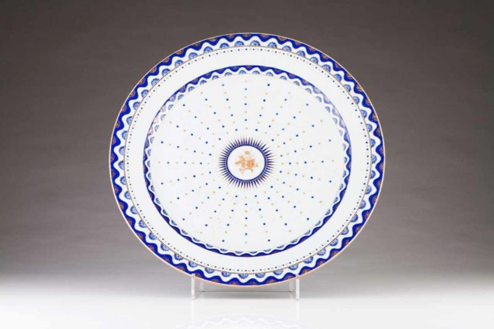 A charger Chinese export porcelain Blue and gilt decoration with medallion at the centre and tab