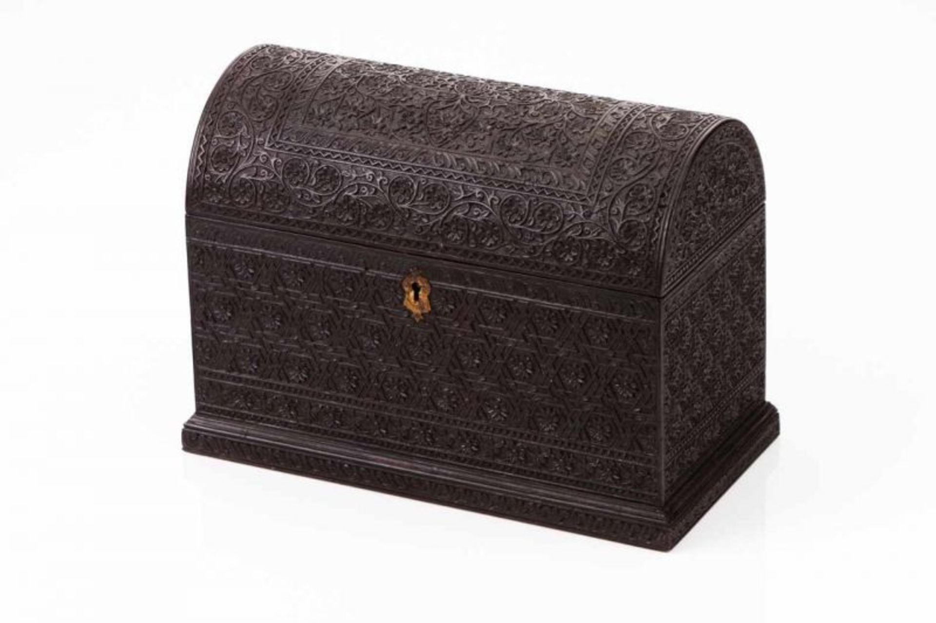 A coffer Carved ebony with floral motifs Divided interior Ceylon, 19th century (small losses and