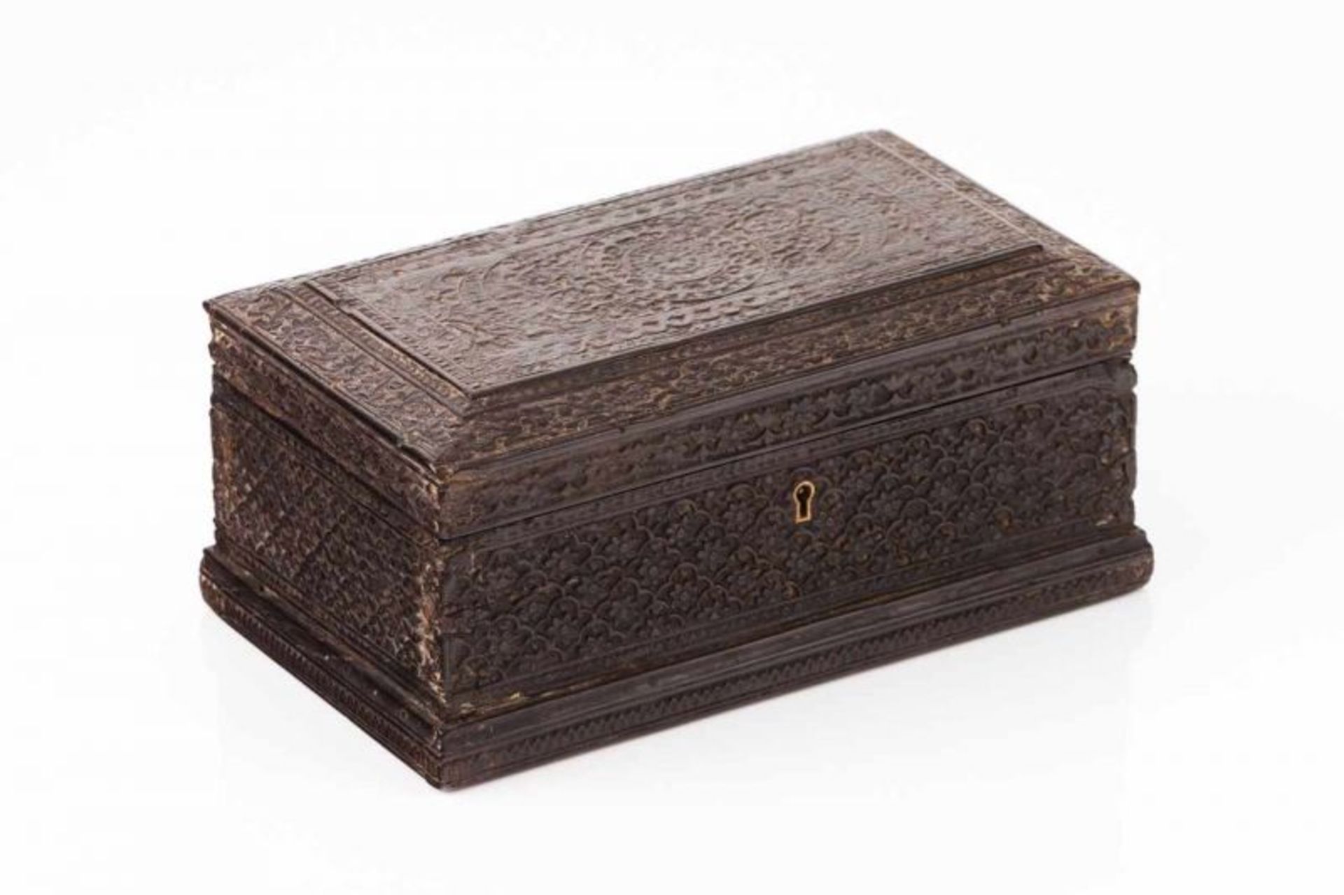 A box Carved ebony with floral motifs Ceylon, 18th century (hinges of later date, small losses) 10,