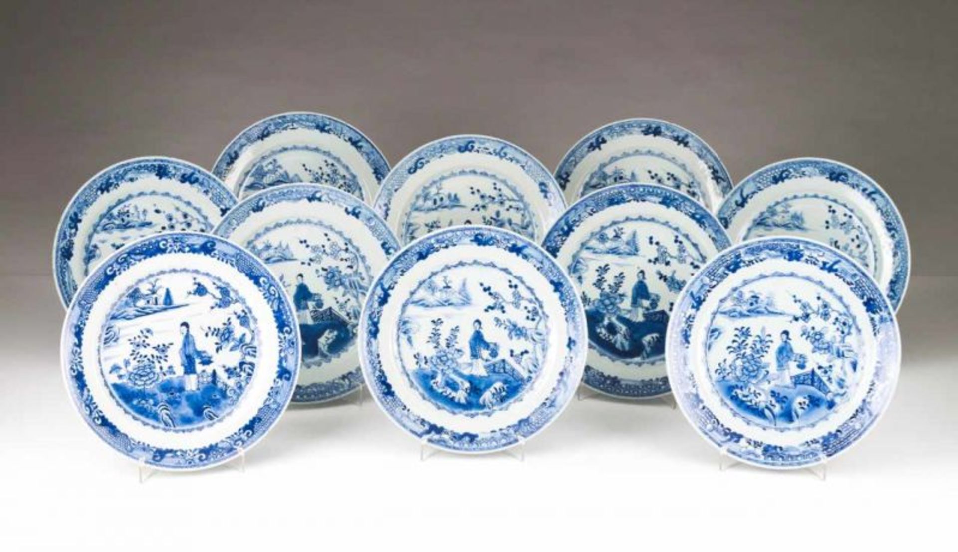 A pair of plates Chinese export porcelain Blue decoration depicting riverscape with garden and