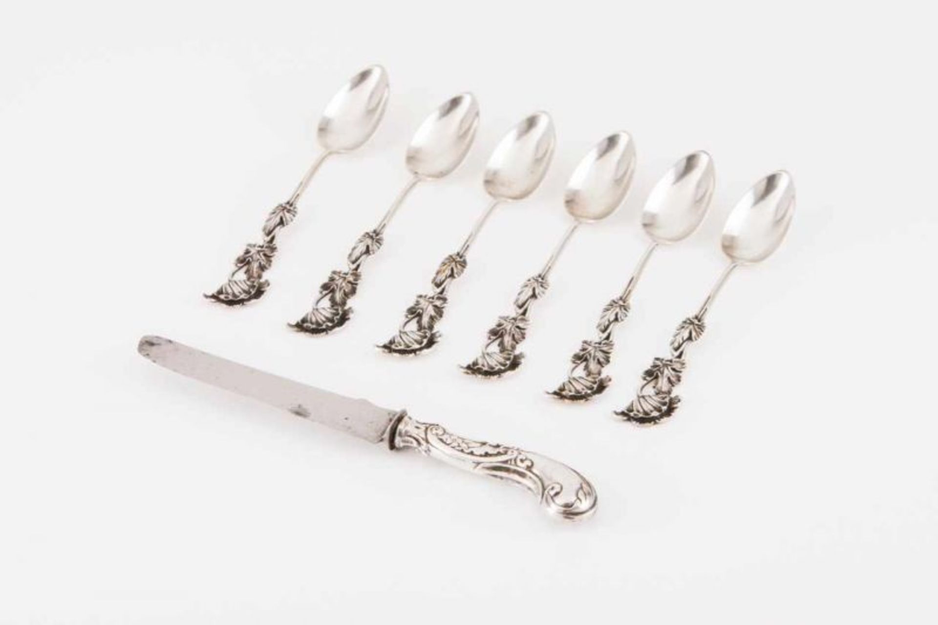A lot of flatware Portuguese silver Comprising six Art Nouveau tea spoons and one small Belle-