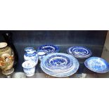 Shelf of predominately blue and white ceramics