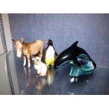 Beswick donkey figure with a Poole and Geobel figure