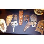 NINE TRIBAL MASKS.