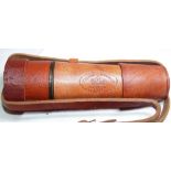 CASED TELESCOPE. Leather cased brass tel