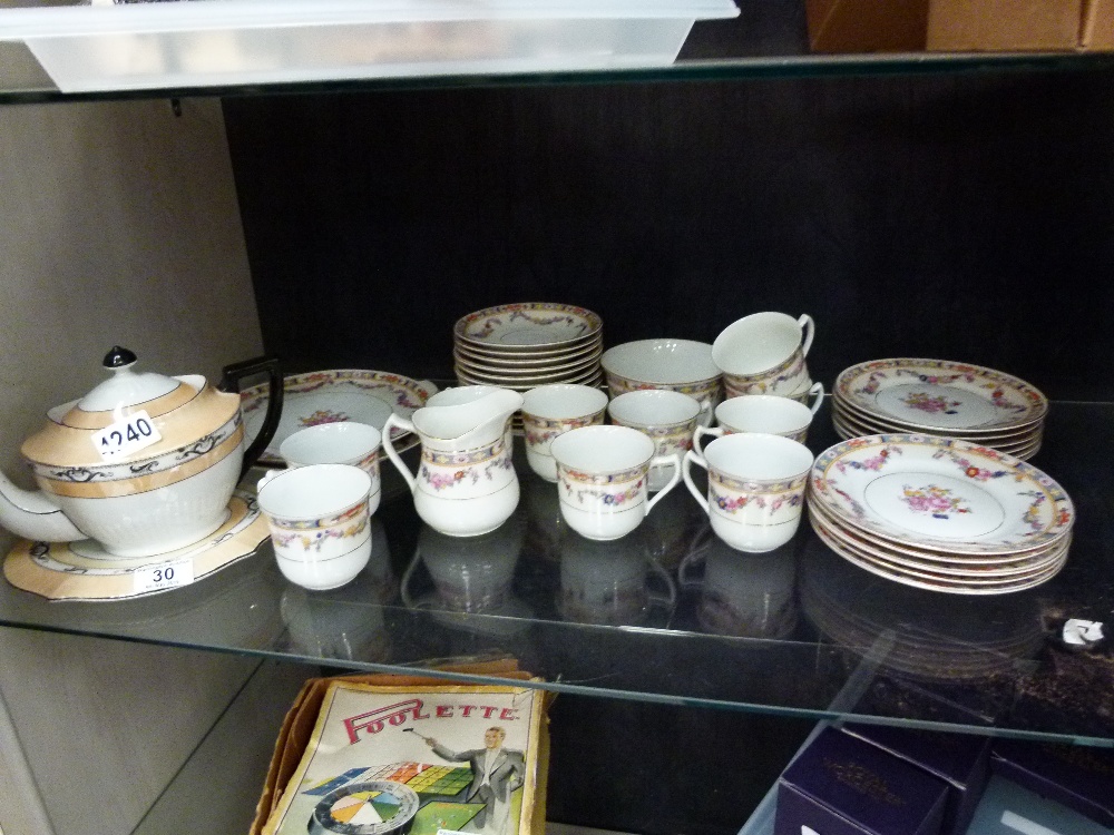 Shelf of china tea ware