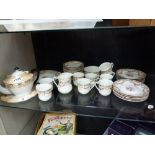 Shelf of china tea ware