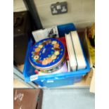 Box of mixed books and a tin of buttons