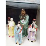 Four moulded Oriental figures,