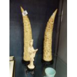 Pair of resin tusks and an Oriental figurine bearing registration mark