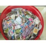 Box of mixed unsorted worldwide postage stamps