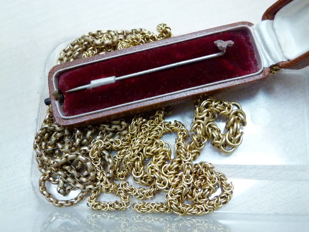 Cased tie pin with enamelled hearts and spades to end and two further yellow metal chains