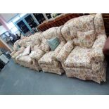 Floral upholstered four piece suite including 3 chairs and 3 seater settee.