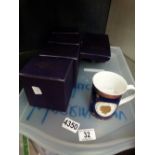 Five boxed Royal Worcester commemorative Queen Elizabeth II mugs