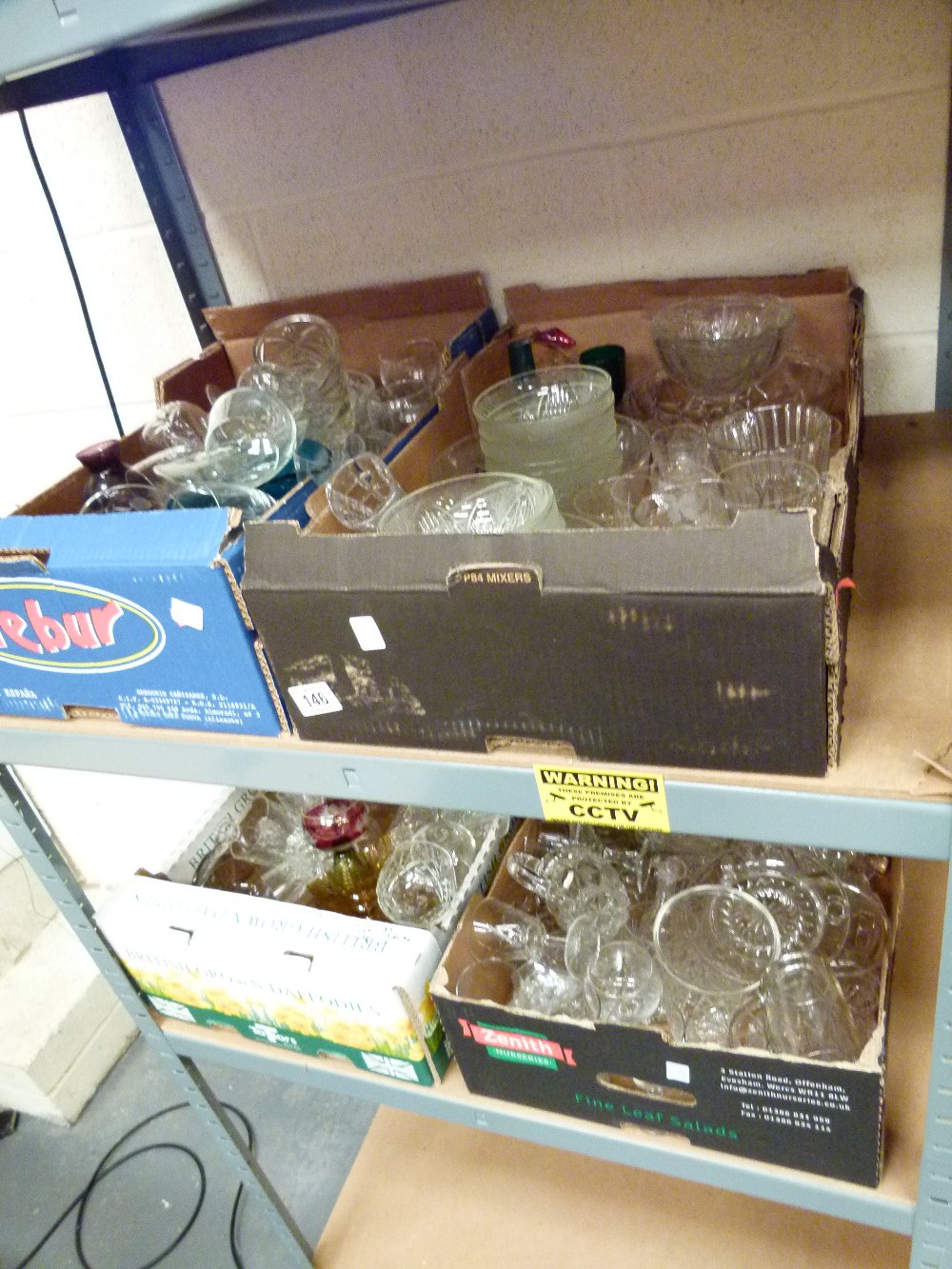 Four boxes of mixed glass