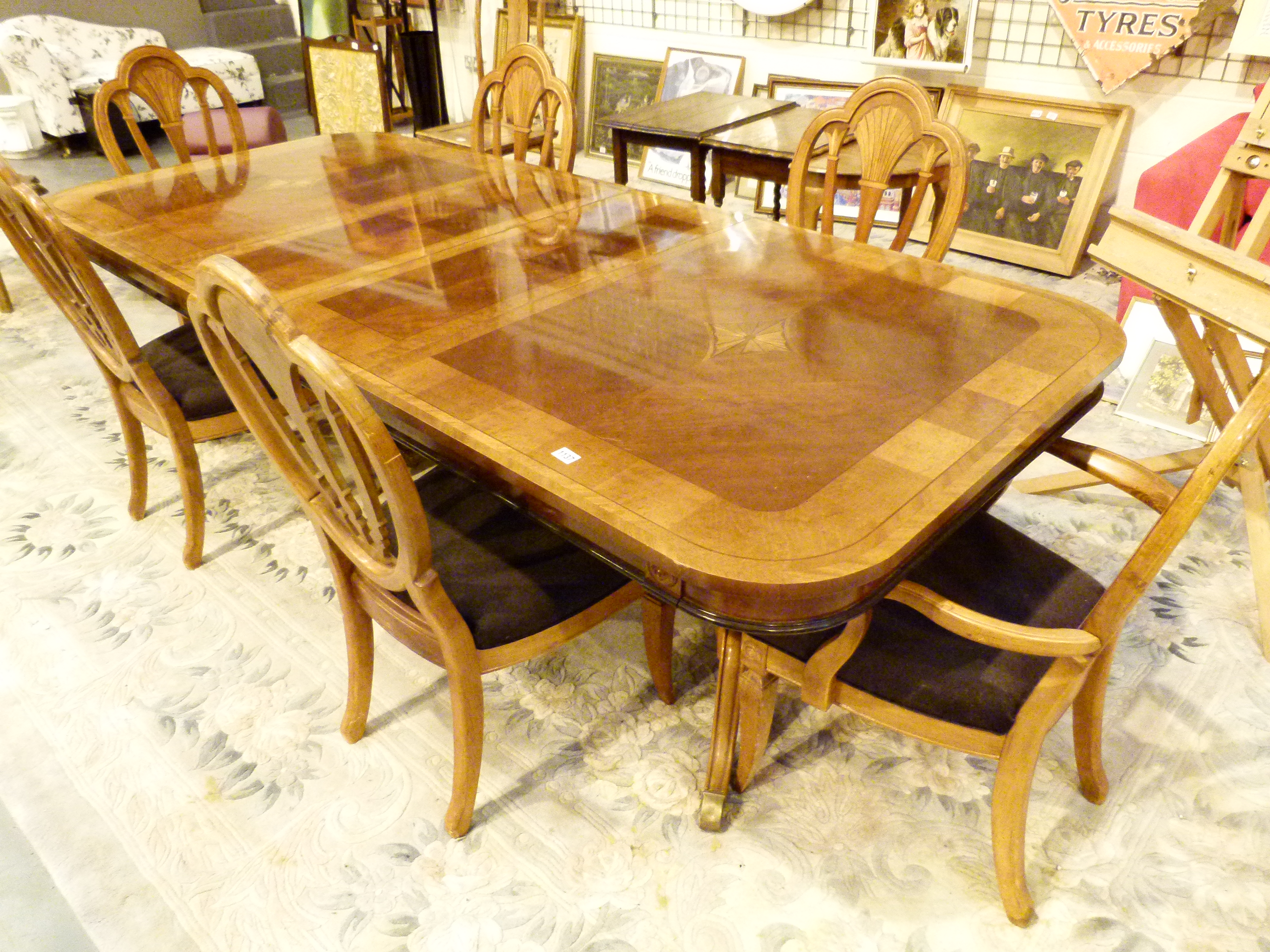 DINING TABLE AND CHAIRS. Inlaid mixed w