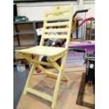 Yellow painted wooden chair