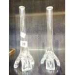 Pair of tall four footed glass vases