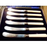 Cased set of 6 hallmarked silver collared knives with bone/ivory handles