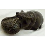 STONE HIPPOPOTAMUS. Carved black stone hippopotamus.