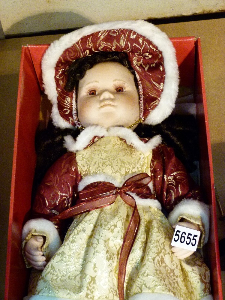Boxed Leonardo Christmas porcelain doll