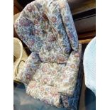 Upholstered reclining armchair