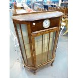 Vintage glazed display cabinet with integral clock