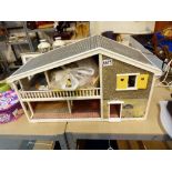 Childs dolls house with furniture