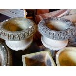 Pair of stone cast garden urns with plinths,
