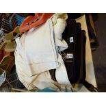 Suitcase with contents including linen,