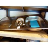 Stainless steel kitchen sink with tops and waste disposal