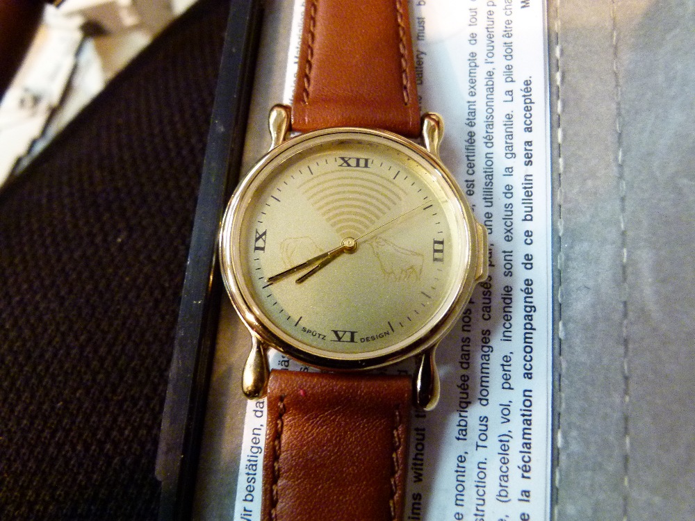 Gents gold coloured face wristwatch with brown leather strap