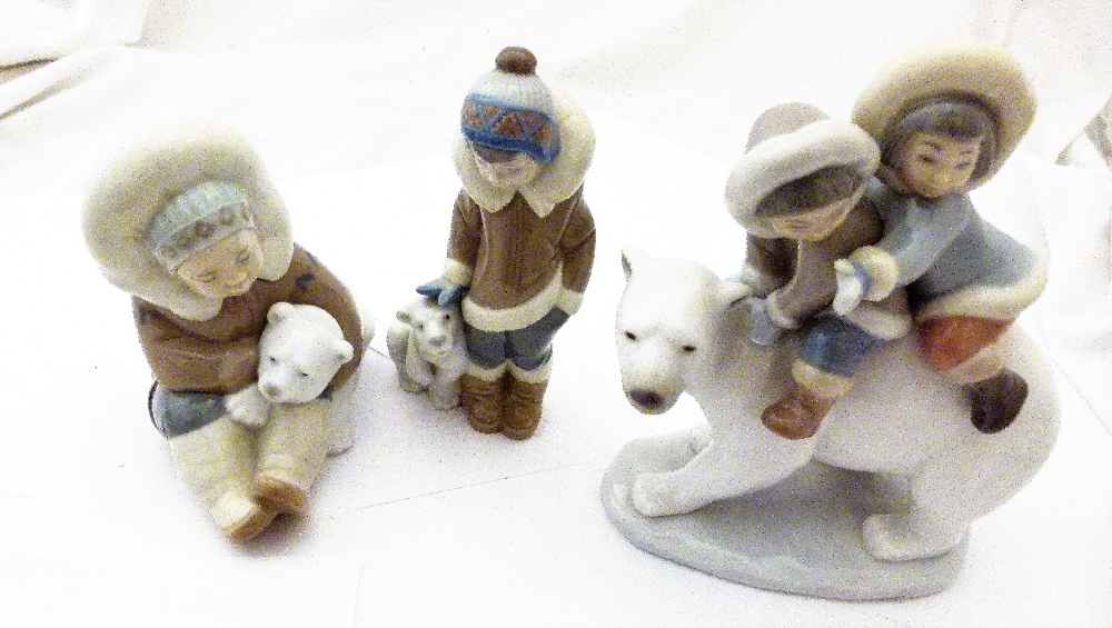 LLADRO ESKIMO FIGURES. Three Lladro Eskimo figures, 2 boxed.