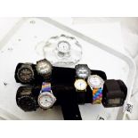 SPORTS FASHION WRISTWATCHES. Eight sports fashion watches and a glass clock.