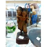 Dutch figurine in light wood depicting two girls