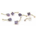 9 CT BELLY STUDS. Seven 9 ct gold stone