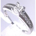 18 CT DIAMOND RING.