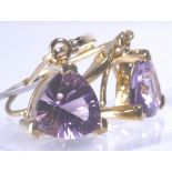 9 CT PURPLE STONE EARRINGS.