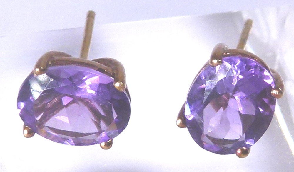 9 CT AMETHYST EARRINGS.