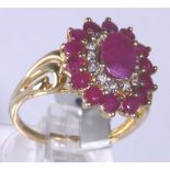 9CT CLUSTER RING. 9ct gold large ruby an