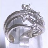 14CT FLOWER RING. 14ct white gold diamon