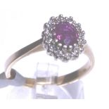 9CT CLUSTER RING. 9ct gold ruby and diam