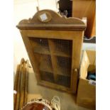 Wall hanging pine cupboard with mesh front