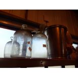 Three glass demijohn's and a stainless steel bucket